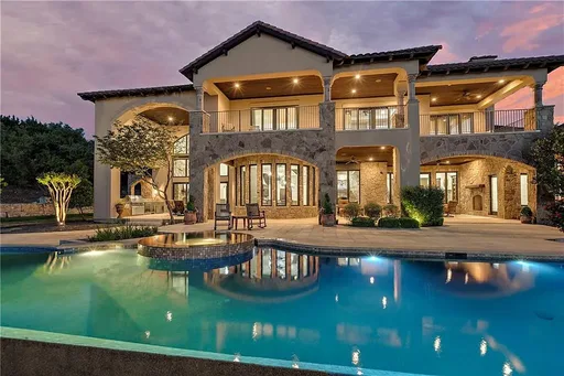 Hill Country home with infinity pool at sunset